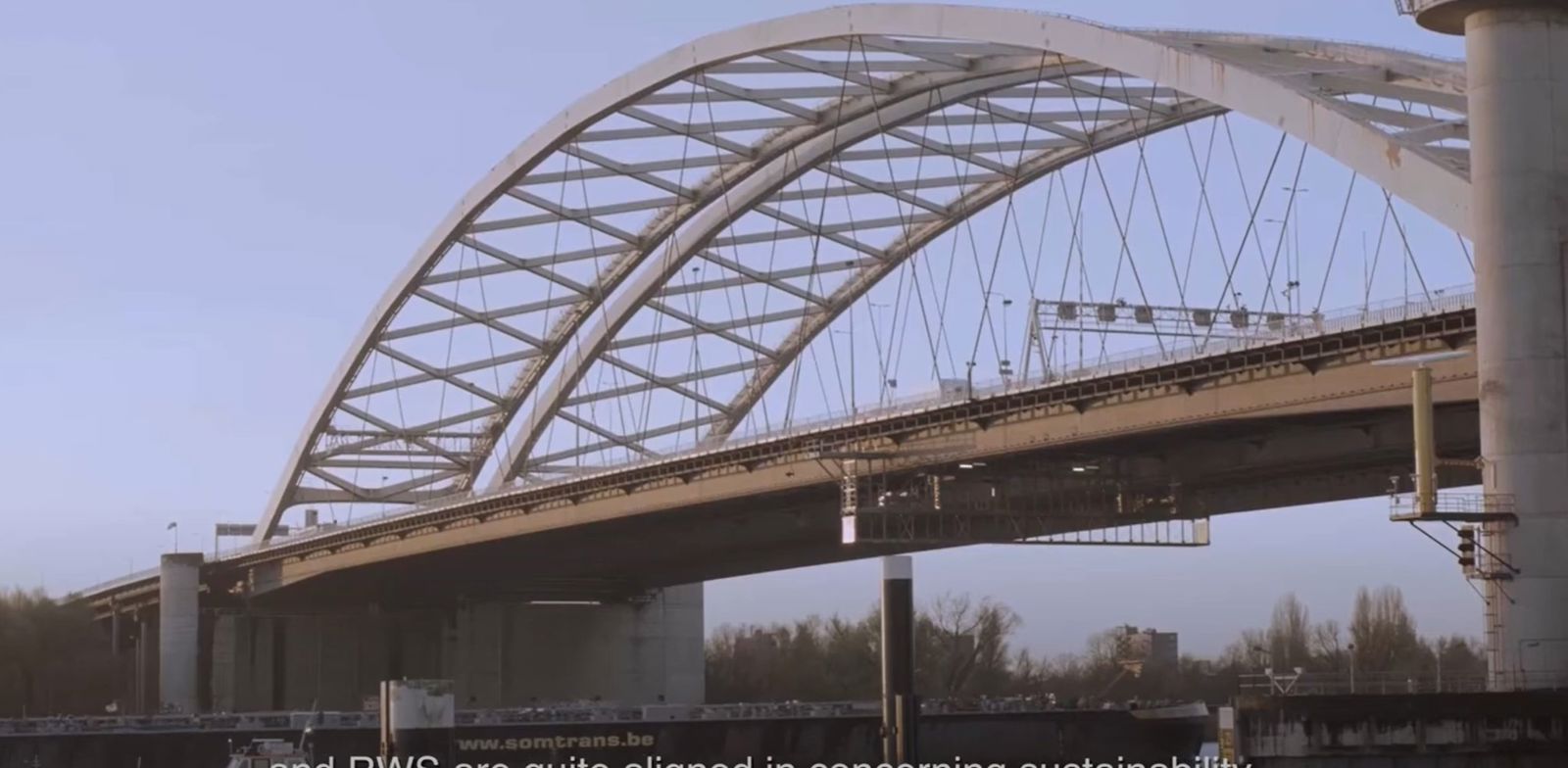 A bridge with a metal frame.