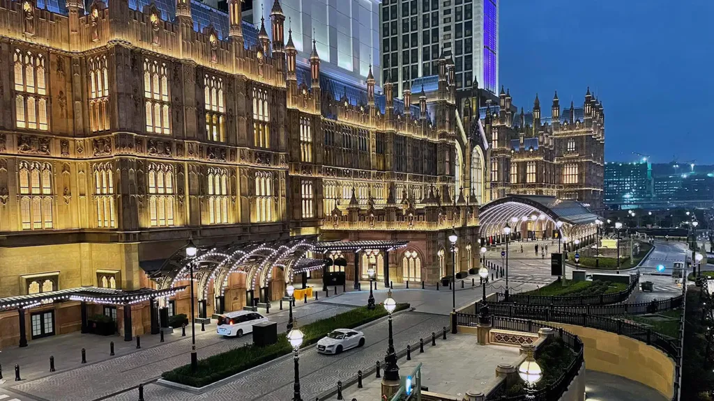A city street with a fountain.