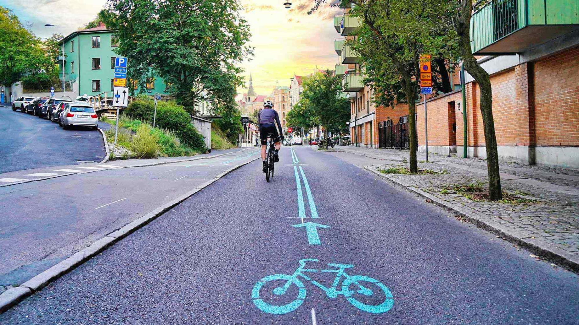 A cyclist in a dedicated cycle lane in a city