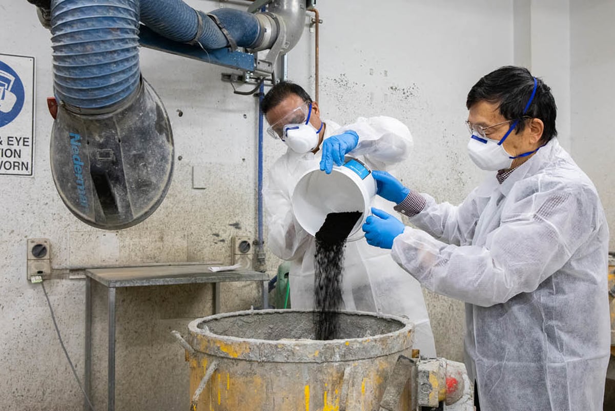 Workers producing concrete from coffee grounds. Credit: RMIT