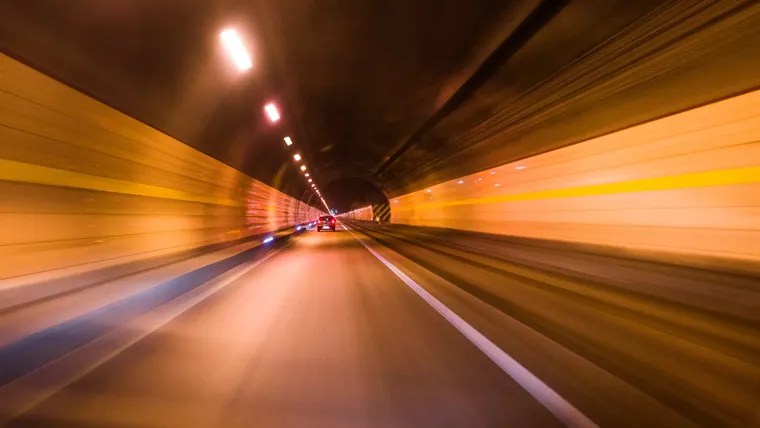 Car driving through tunnel