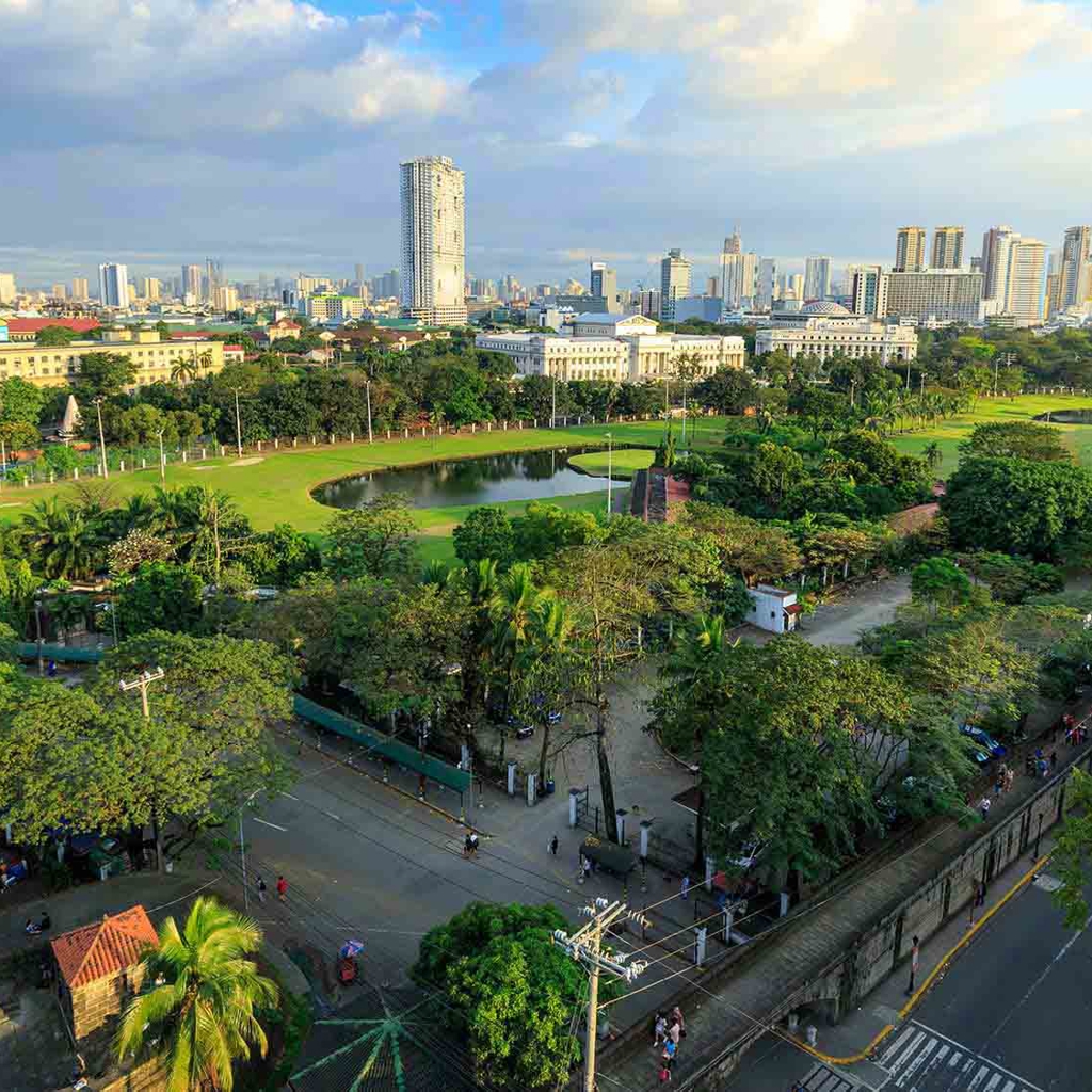 Aerial view across a green space in a city