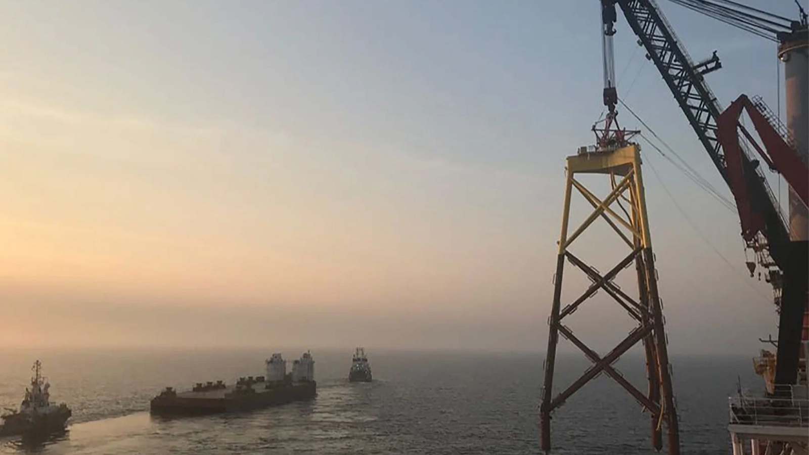Offshore wind turbine being built at sea
