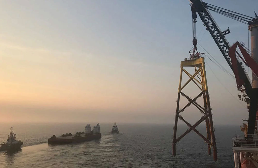 Offshore wind turbine being built at sea