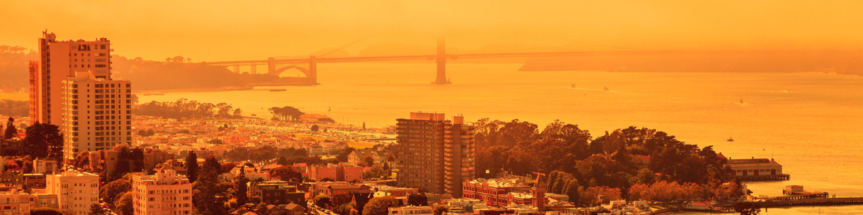 A view across a city in an orange hue