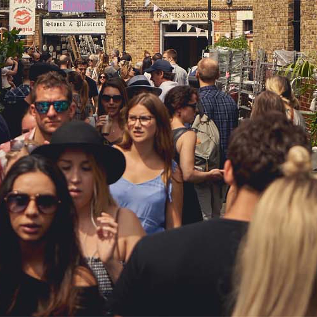 People walking down a busy street