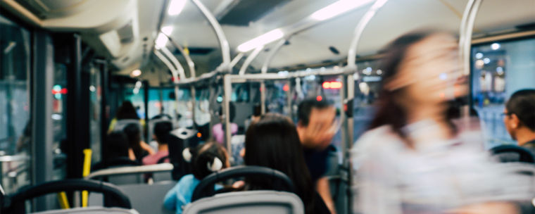 Blurry shot of people using public transport