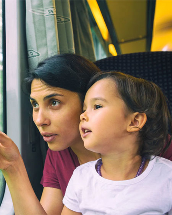 Mother and child looking out of a train window