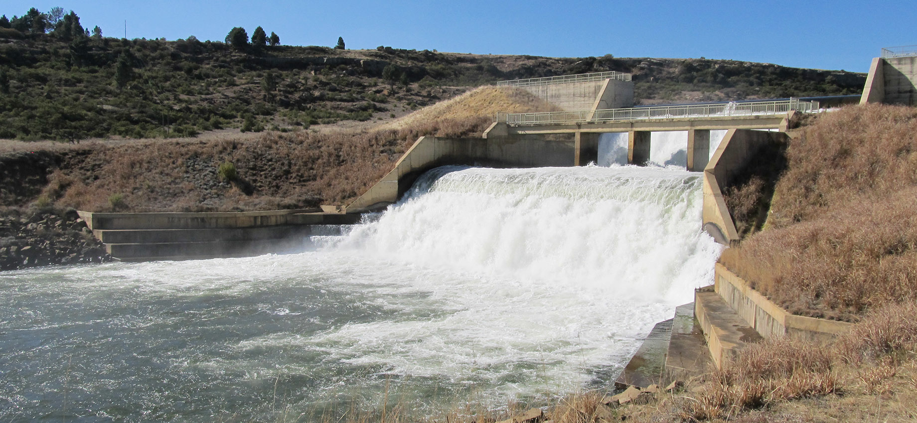 Water flowing through a dam