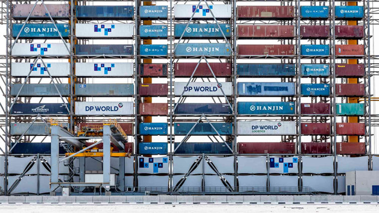 Shipping containers sit at a port