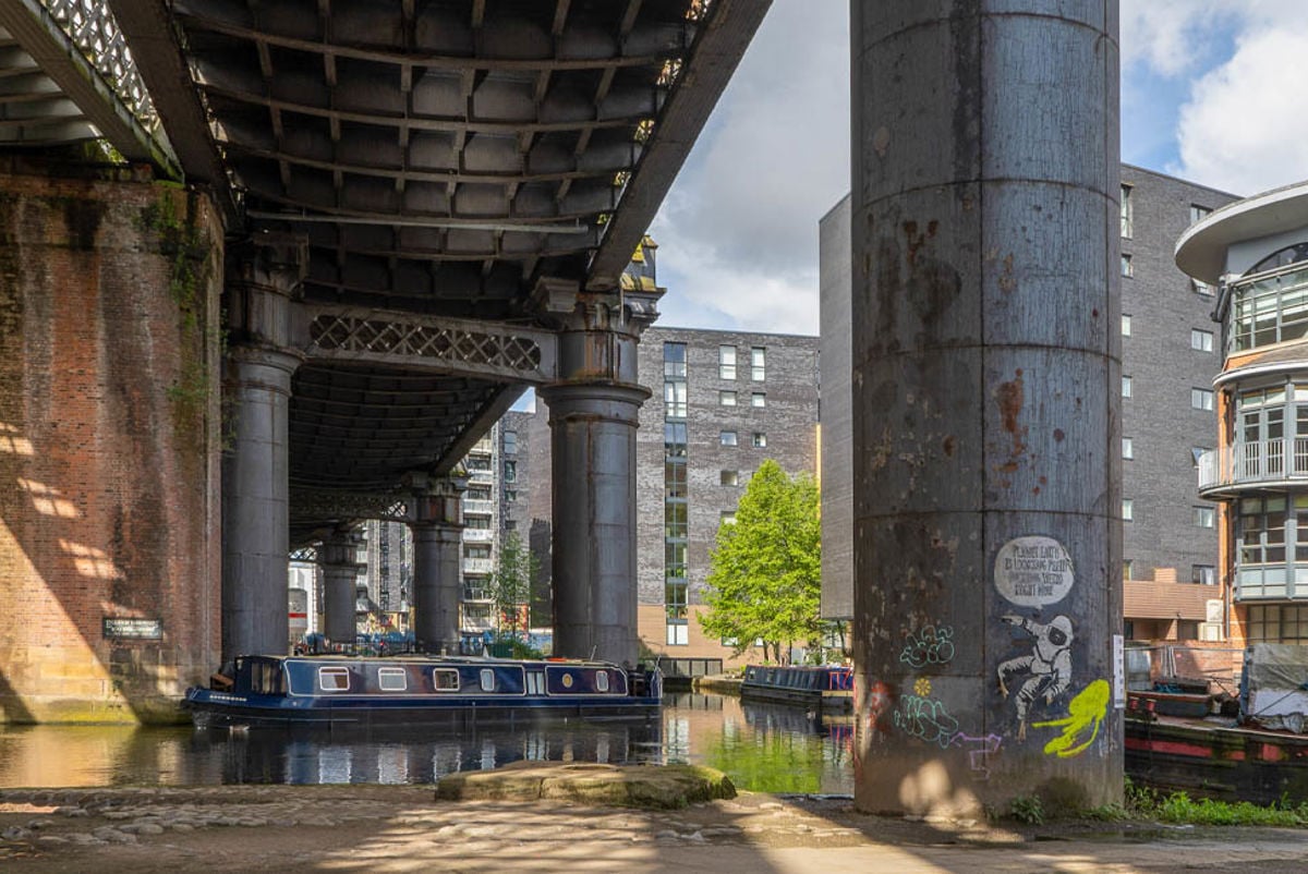 A boat underneath Castlefield Viaduct