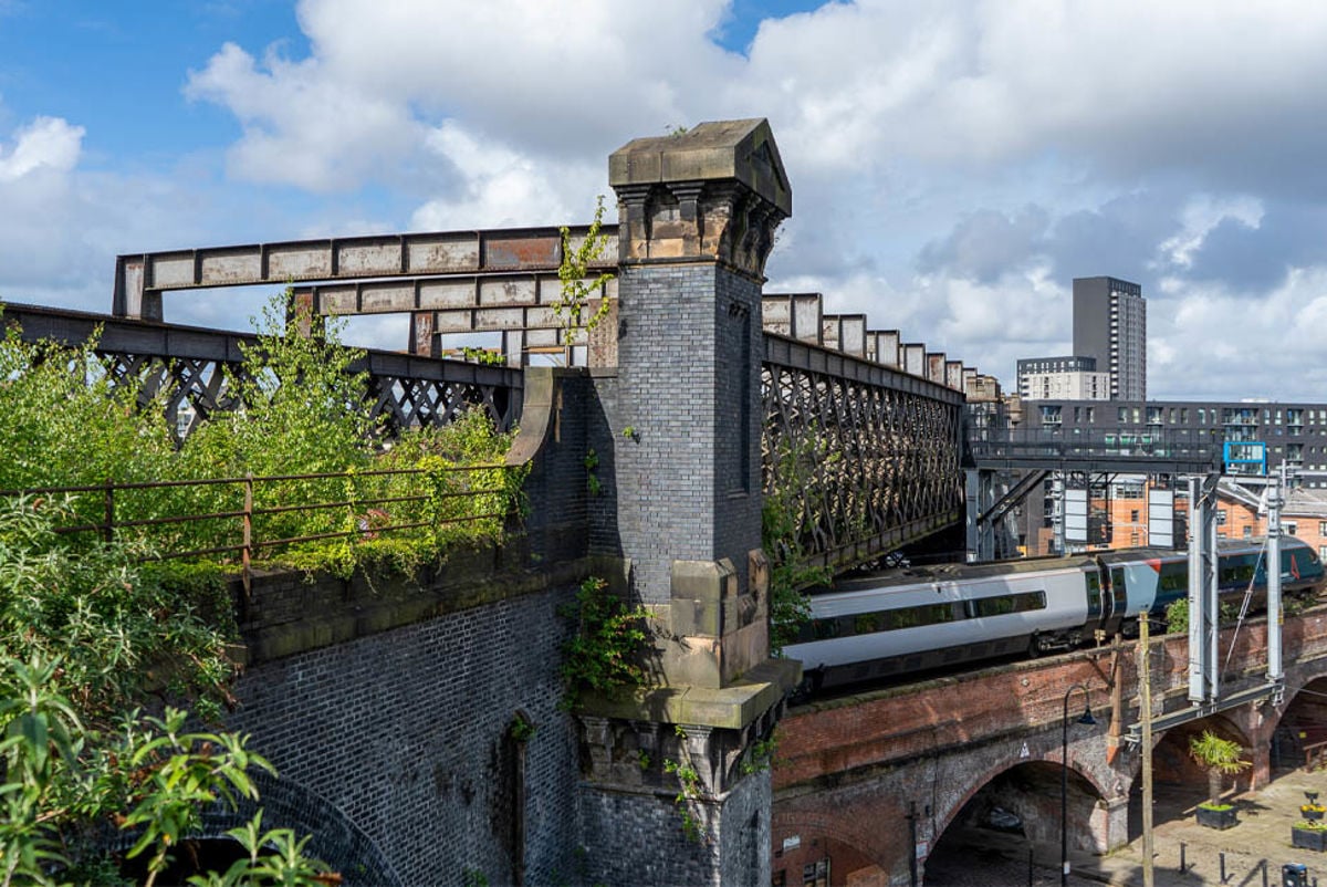 Train travelling underneath Castlefield Viaduct