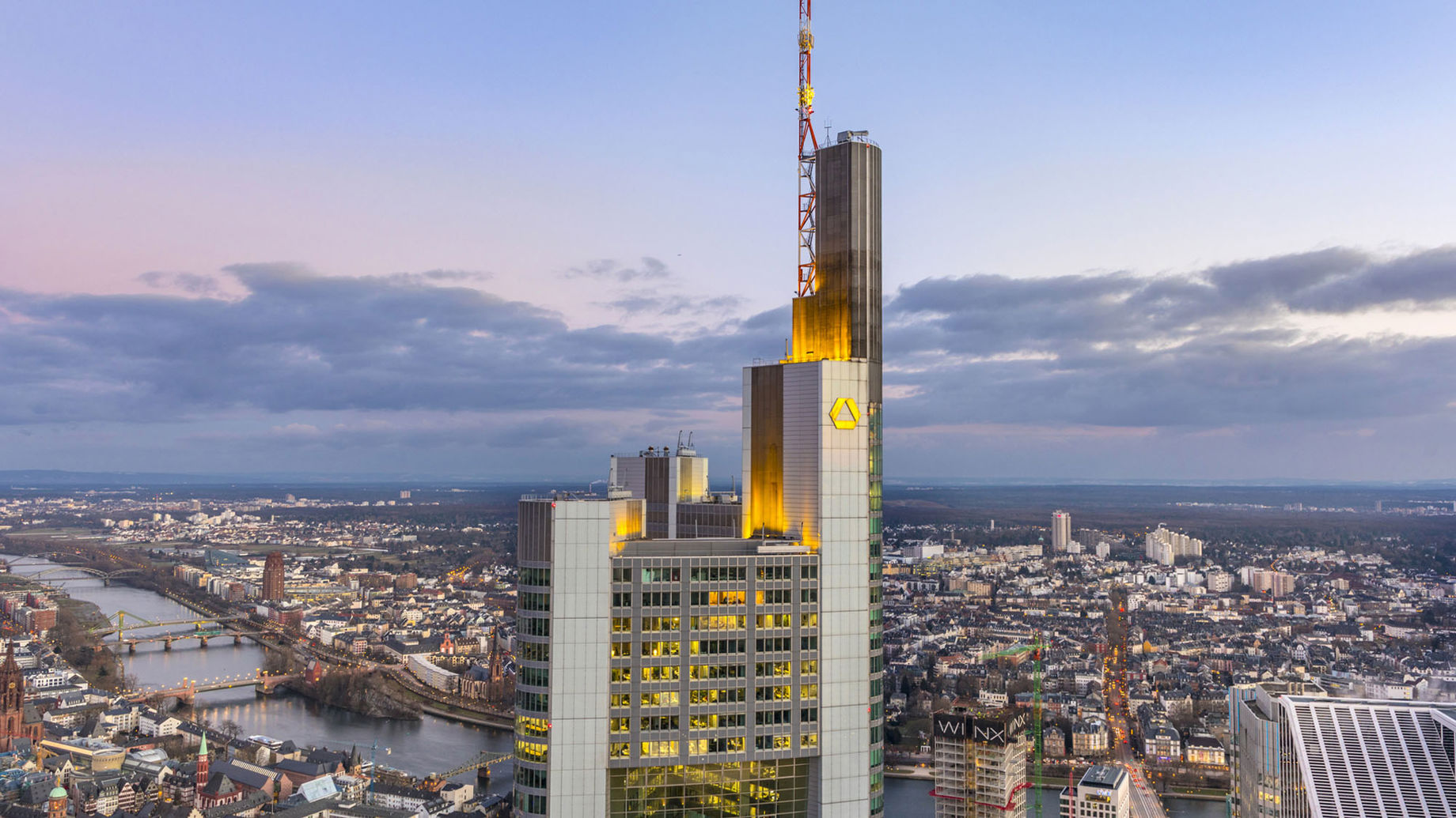 A view of the top of Commerzbank Tower with the city in the background