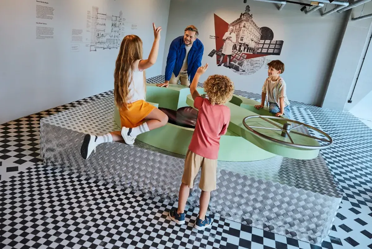 People interacting with an exhibit in a museum