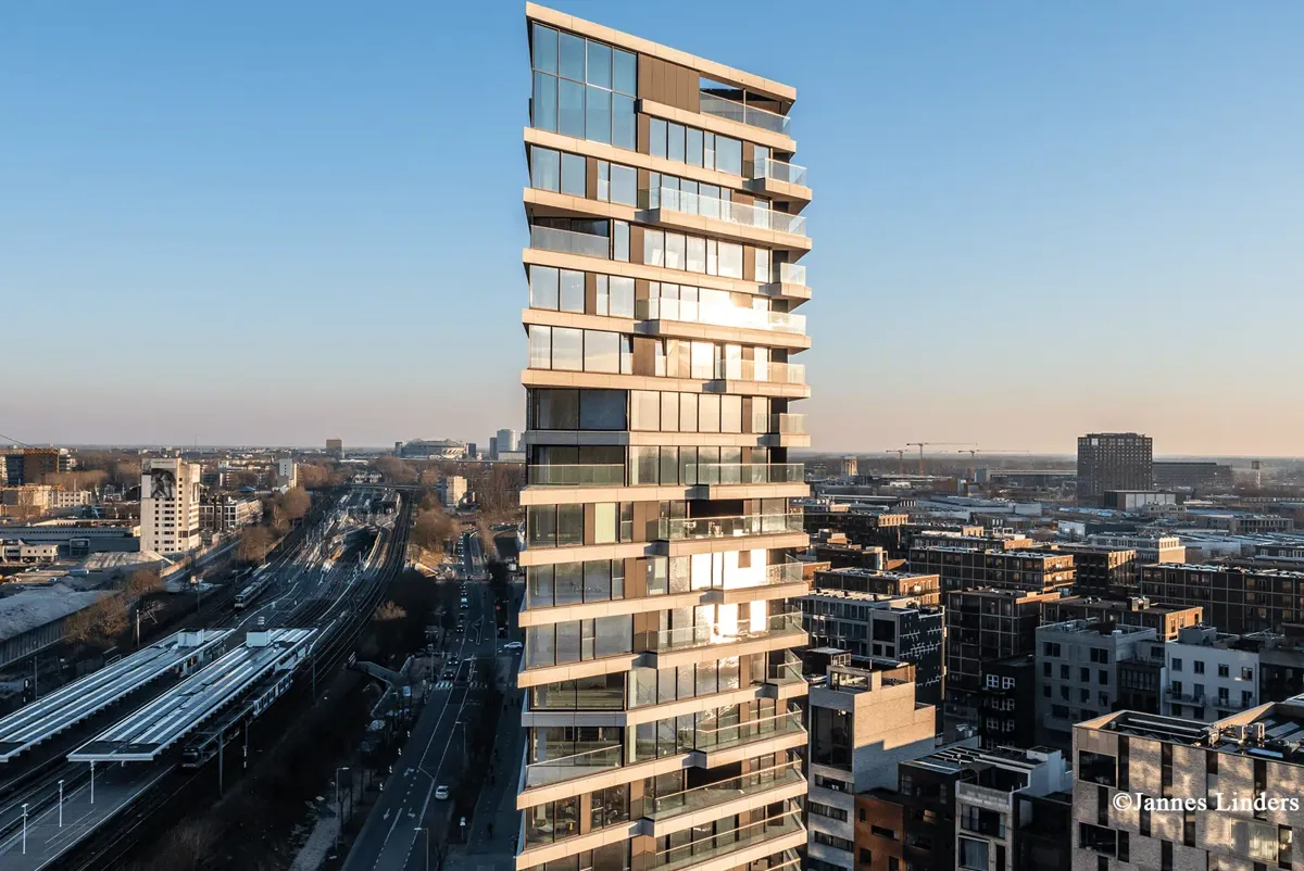 Exterior shot of HAUT, a tall timber-hybrid residential building. Credit: Jannes Linders