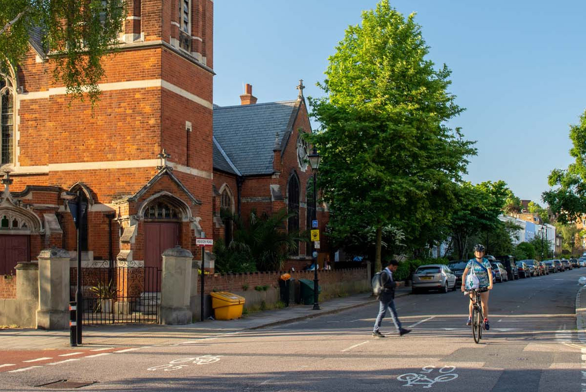 A cyclist and pedestrians on a street in Lambeth, London
