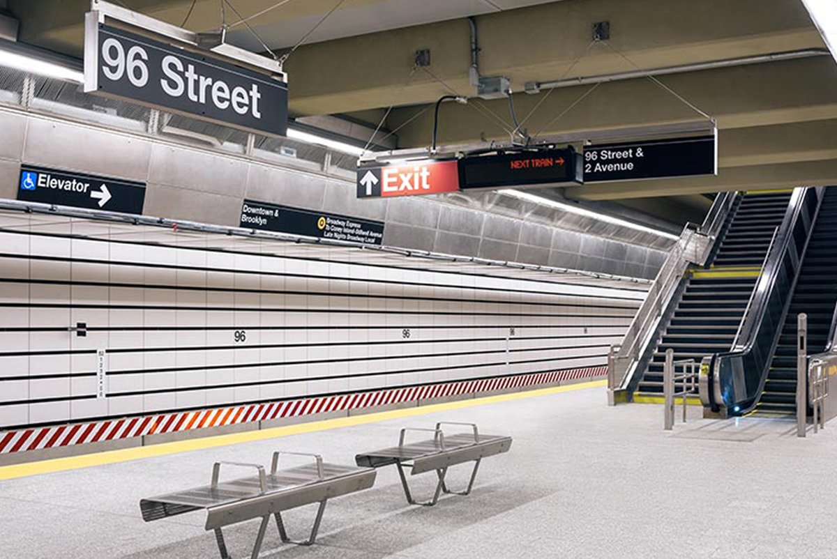 On the platform at 96th Street Station, the noise-absorbing panels made from ceramic, metal and fibreglass are clearly visible, inset into the wall. 