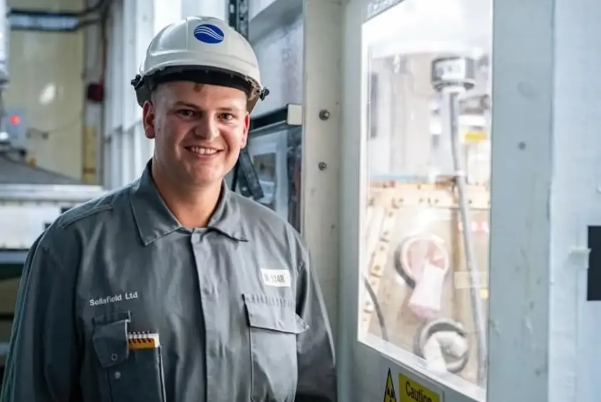 An engineer in a hard hat in a building at Sellafield