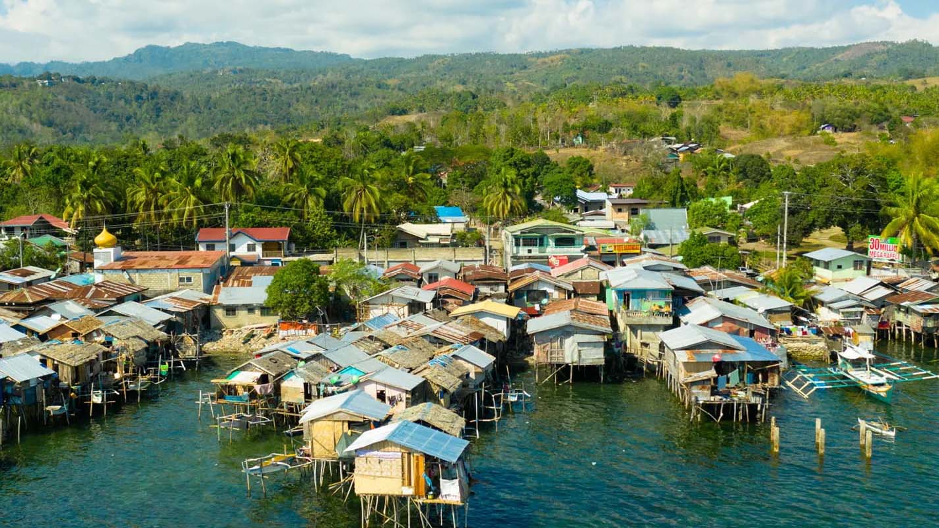 Wooden houses built on the river in a low socio-economic neighbourhood in an Asian city