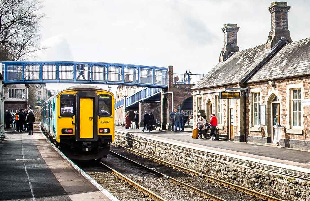 Commuter train at a station in the UK