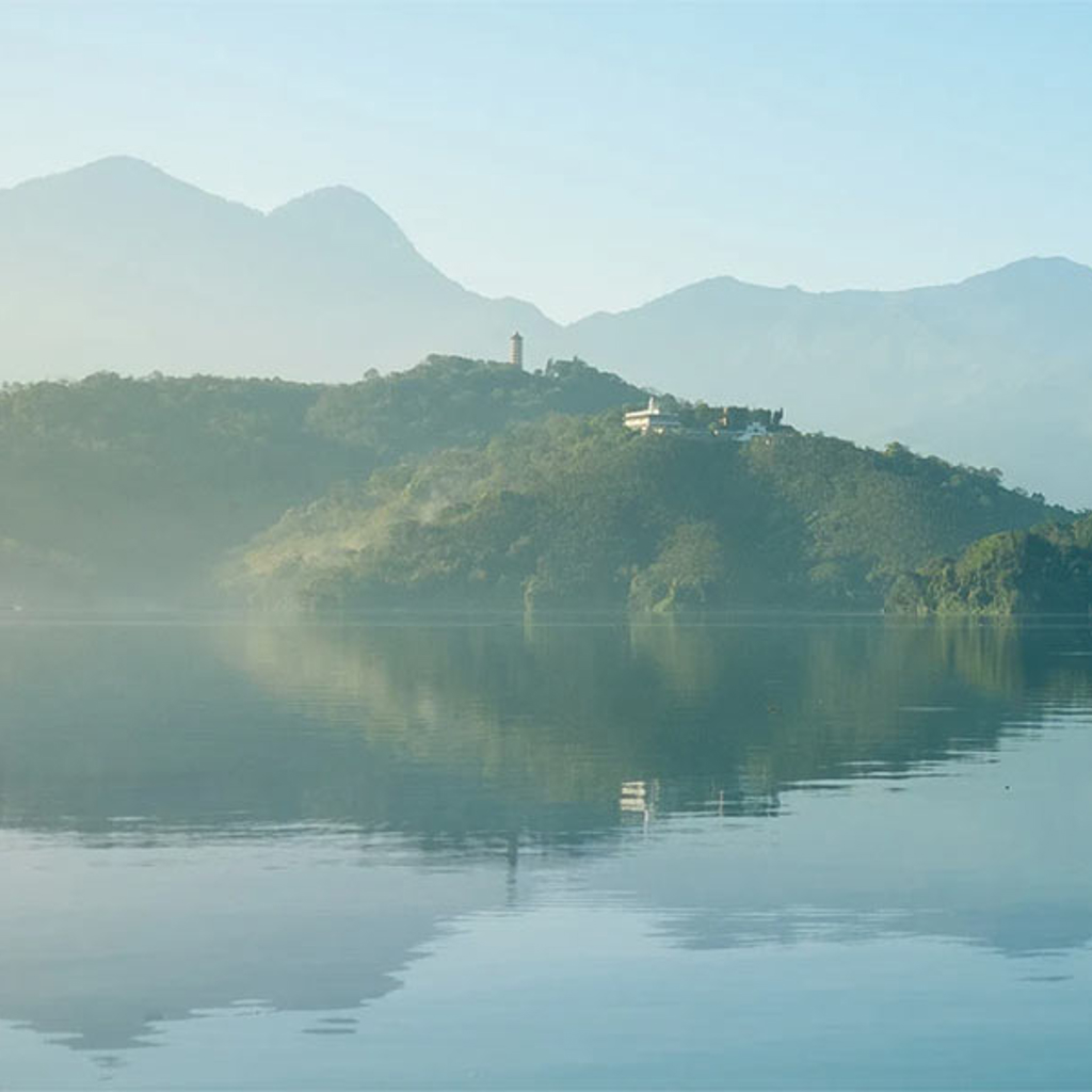 Lake with mountains in the background